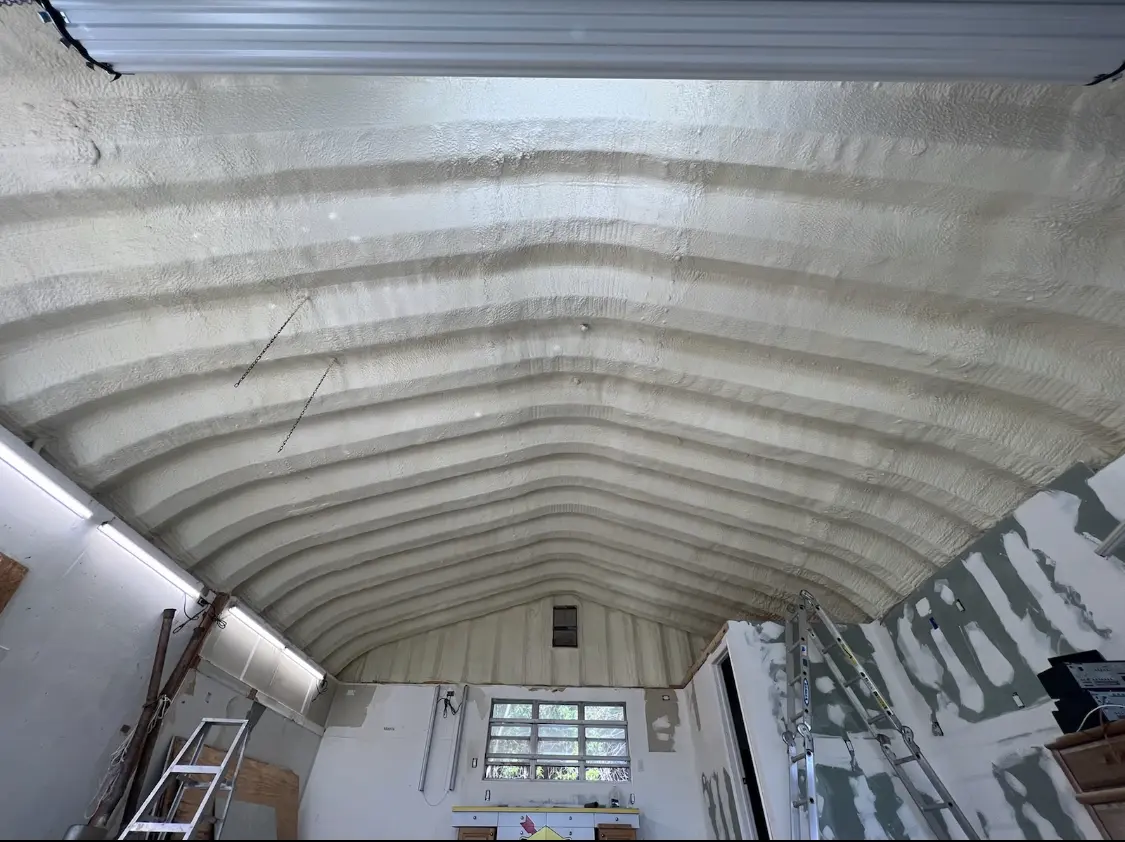 Spray polyurethane foam applied to the underside of a metal roof deck in Discovery Bay